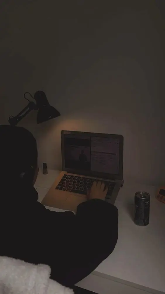 Dark tech image of girl using laptop, Market wit Shahala, Digital Marketer, Graphic Designing